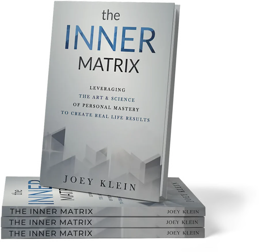 The Inner Matrix by Joey Klein, standing on a stack of copies